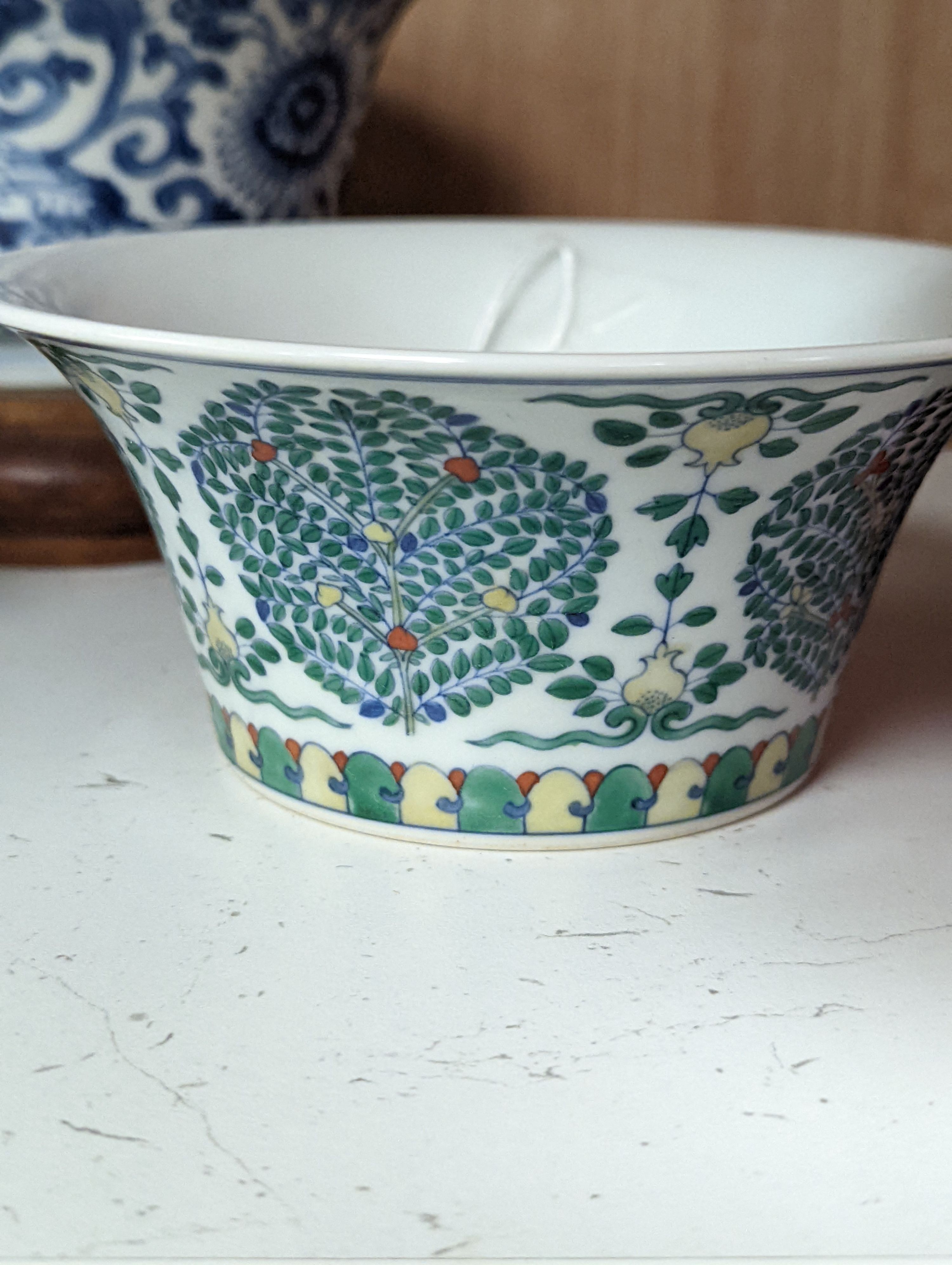 A Chinese blue and white bowl, Kangxi, 15cm. diam., a famille rose teapot stand, Yongzheng, and two doucai bowls